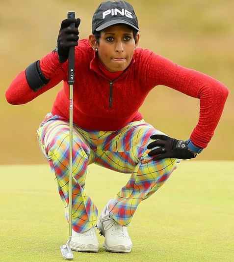 Naga Munchetty while playing golf.